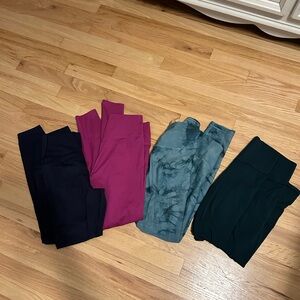Bundle of Four Women's Leggings in Navy, Fusia, Blue, and Forrest Green.